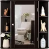 A bathroom cabinet with a mirror reflecting a toilet and shower.