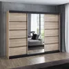 A modern sliding door wardrobe with a wood-effect finish and mirrored doors, set in a bedroom. Produktbild-Vorschau