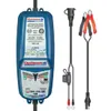A battery charger and its accessories are laid out against a white background. Voir les images du produit