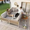 A couple relaxing on a modular outdoor sofa set on a balcony. Voir les images du produit