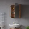 A bathroom vanity with a medicine cabinet and sink. Náhled obrázku produktu