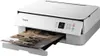 A white Canon PIXMA TS5351a printer is shown from a slightly elevated front-left angle, printing a document. Podgląd zdjęcia produktu