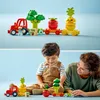A mother and child playing with LEGO DUPLO toys. Produktbild-Vorschau