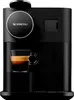 A black Nespresso coffee machine with a cup of espresso on a drip tray. Produktbild-Vorschau