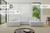 A modern living room with a large grey U-shaped sofa. Produktbild-Vorschau