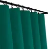 A close-up view of teal-colored curtains hanging from a black curtain rod. Podgląd zdjęcia produktu