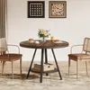 A round dining table with two chairs in a room setting. Produktbild-Vorschau