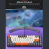 A gaming keyboard is shown in front of a blurred computer monitor displaying a game. Produktbild-Vorschau