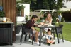 A family enjoying a meal on their patio. Náhled obrázku produktu