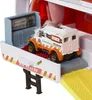 A finger is pressing down on a toy emergency vehicle inside a larger toy vehicle. Anteprima dell’immagine prodotto