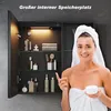 A woman wrapped in a towel is holding a jar of cream in front of an open medicine cabinet filled with toiletries. Produktbild-Vorschau