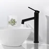 A black faucet is shown above a white sink, with water flowing from the faucet. Náhled obrázku produktu