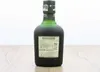 A bottle of Diplomático Reserva Exclusiva rum on a wooden surface. Voir les images du produit