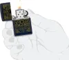 A hand holding a Zippo lighter with a flame. Podgląd zdjęcia produktu