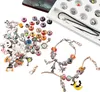 A collection of Halloween-themed charms and beads for jewelry making, along with a necklace and bracelet, laid out on a white surface. Produktbild-Vorschau