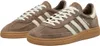 A pair of brown Adidas Handball Spezial sneakers shown from a diagonal angle against a white background. Voir les images du produit
