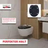 A modern bathroom setting featuring a wall-mounted toilet with a black toilet seat, accompanied by marketing text and a product detail overlay. Produktbild-Vorschau