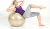 A woman is performing an exercise on a stability ball. Podgląd zdjęcia produktu