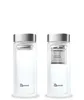 Two identical glass bottles with silver lids, one showing an empty infuser basket and the other with the infuser basket in place. Produktbild-Vorschau