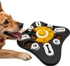 A dog is looking at an interactive puzzle toy filled with dog food. Podgląd zdjęcia produktu
