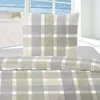 A close-up view of bedding with a plaid pattern. Produktbild-Vorschau