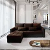 A modern living room with a brown sectional sofa, a coffee table, and a staircase in the background. Produktbild-Vorschau
