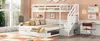 A white bunk bed with a trundle bed and stairs, set up in a bedroom with a large window. Podgląd zdjęcia produktu