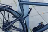 A bicycle is locked to a pole with a folding lock. Voir les images du produit
