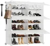 A white modular shoe rack filled with various types of shoes and boots. Produktbild-Vorschau