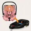 A pink baby car seat is shown next to its black base, with an orange arrow indicating how they connect. Náhled obrázku produktu
