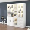 A modern white display cabinet with LED lighting against a dark blue wall. Podgląd zdjęcia produktu