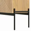 A close-up view of the bottom section of a wooden cabinet with black metal legs. Anteprima dell’immagine prodotto