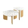 Two round coffee tables with terrazzo-style tops and wooden legs, presented on a white background. Voir les images du produit