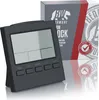 A digital alarm clock and its packaging are displayed on a reflective surface with a white and light gray background. Produktbild-Vorschau
