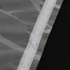 A close-up view of a sheer curtain with a white branch pattern and a white header tape. Produktbild-Vorschau