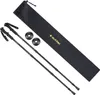 A pair of black trekking poles with a black carrying bag and two black pole baskets, laid out on a white background. Produktbild-Vorschau