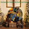 A stained-glass cat figurine is displayed in a festive, decorated setting with Christmas trees and gift boxes. Produktbild-Vorschau