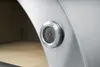 A close-up view of a thermometer on the side of a stainless steel pizza oven. Produktbild-Vorschau