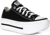 A black Converse sneaker with a white platform sole is shown against a white background. Voir les images du produit