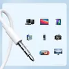 A white audio cable with a 3.5mm jack connector is shown in the foreground, with various electronic devices displayed in the background. Produktbild-Vorschau