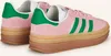 A pair of Adidas Gazelle Bold W sneakers in pink and green. Produktbild-Vorschau