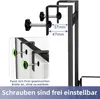 Close-up view of a black metal shower caddy bracket with adjustable screws, demonstrating its mounting mechanism. The image includes German text and measurement indicators. Anteprima dell’immagine prodotto