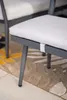 A close-up of a chair cushion and its frame, with a rug in the background. Produktbild-Vorschau