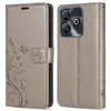 A flip-style phone case for a ZTE Blade A75, shown in a light gray color with a floral and butterfly embossed design. Produktbild-Vorschau