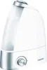 A white humidifier with a silver base and control knob, shown against a white background. Podgląd zdjęcia produktu