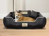 A corgi dog is lying in a black dog bed with two small pillows. Anteprima dell’immagine prodotto