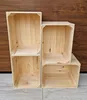 Four wooden crates are stacked in a 2x2 arrangement against a wooden background. Náhled obrázku produktu