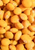 A close-up, overhead view of many yellow lupini beans. Produktbild-Vorschau