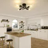 A modern kitchen with a Sputnik-style ceiling light fixture. Voir les images du produit