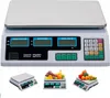 A digital scale with multiple displays and a keypad, shown with fruits and vegetables on top in some of the smaller inset images. Voir les images du produit